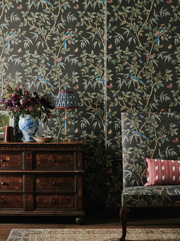 Colefax and Fowler wallpaper featuring a black floral print in a living room setting