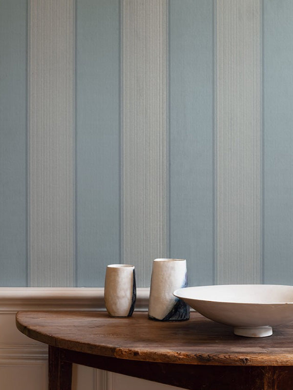 Colefax and Fowler wallpaper featuring a blue striped print in a living room setting