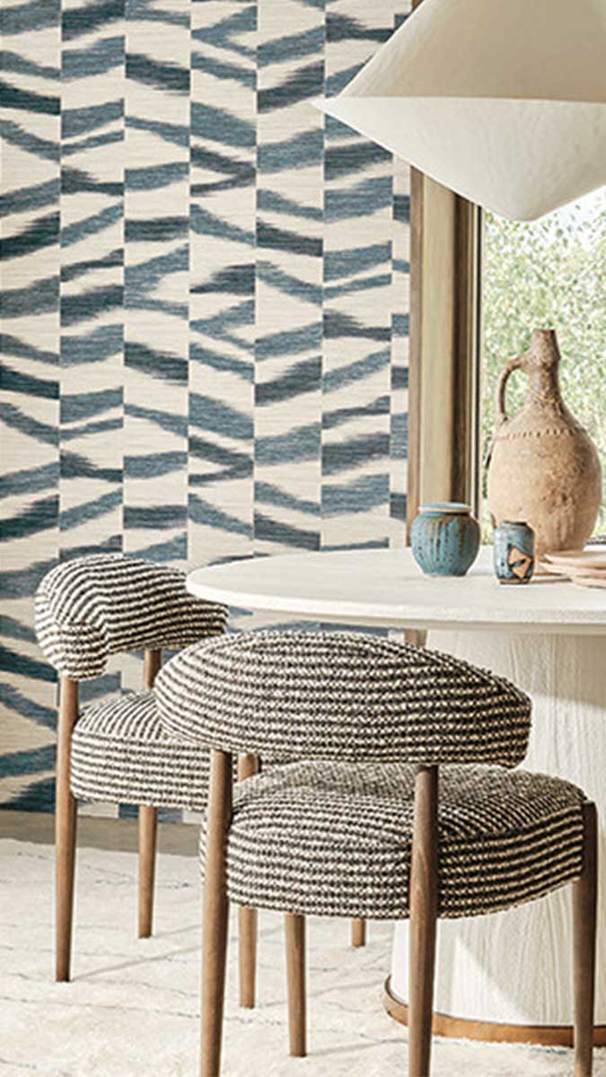 Romo wallpaper featuring a blue geometric print in a dining room setting