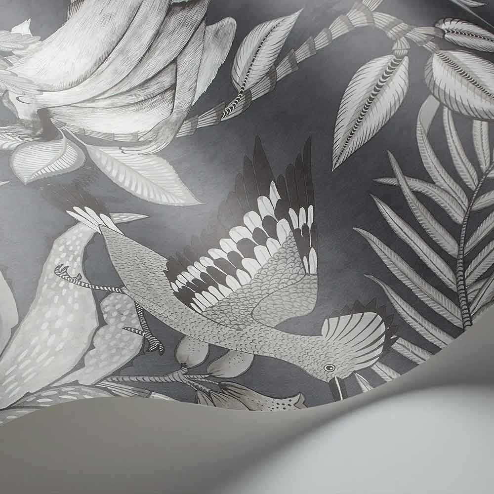 Cole & Son Savuti Wallpaper display unrolled to view the botanical pattern in striking charcoal