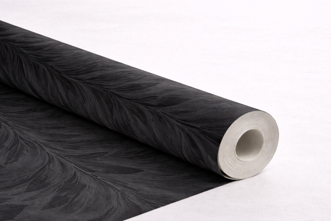 Black wallpaper roll showing tonal variation and texture