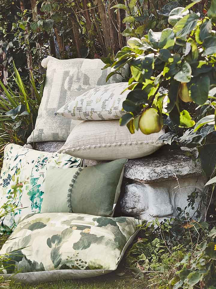 Cushions | Ready Made Cushions | Featuring Villa Nova Still Life Cushions, a pile of sumptuous cushion placed within a garden setting | Fresh & inspiring for spring