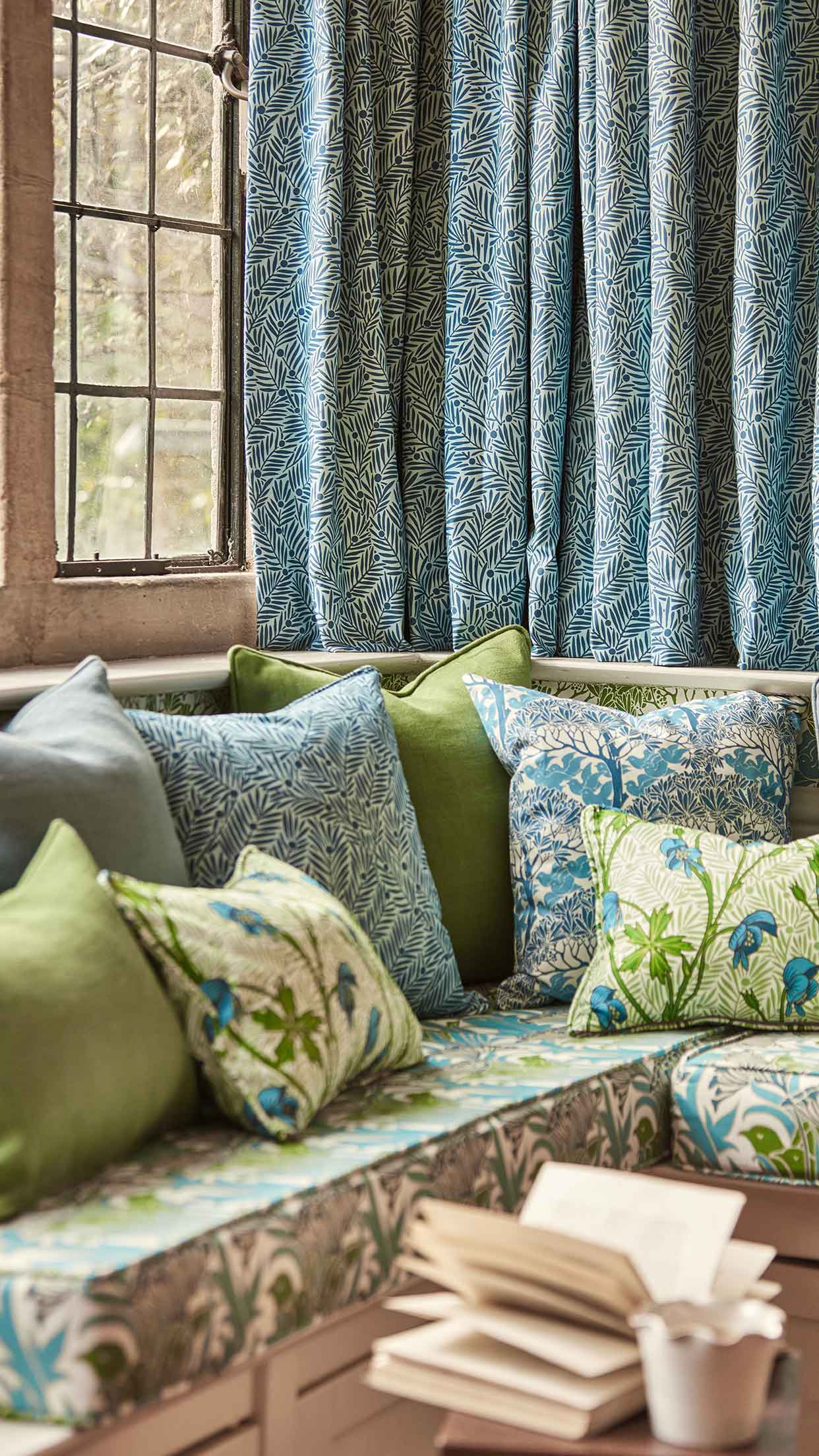 Morris & Co Bedford Park Wallpaper & Fabric Collection | Featuring an arts & crafts style living room with feature fabrics in a botanical prints
